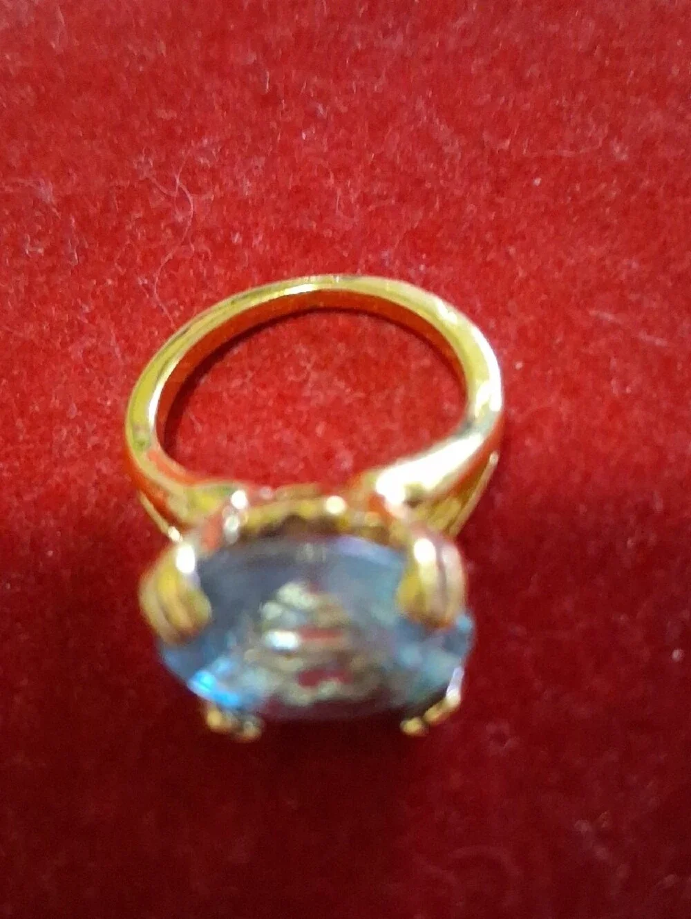 Source Unknown Gold Ring with Light Blue Round Stone